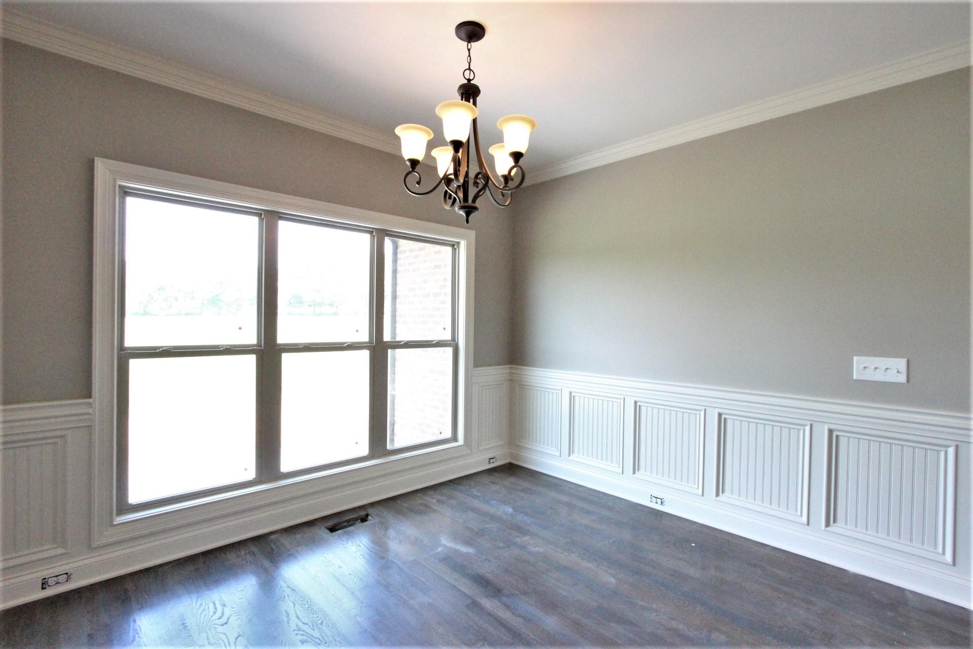 807 Philadelphia Road, Unit 3 Lebanon, TN 37087 - Photo 14 of 23 a view of a livingroom with a chandelier fan and wooden floor