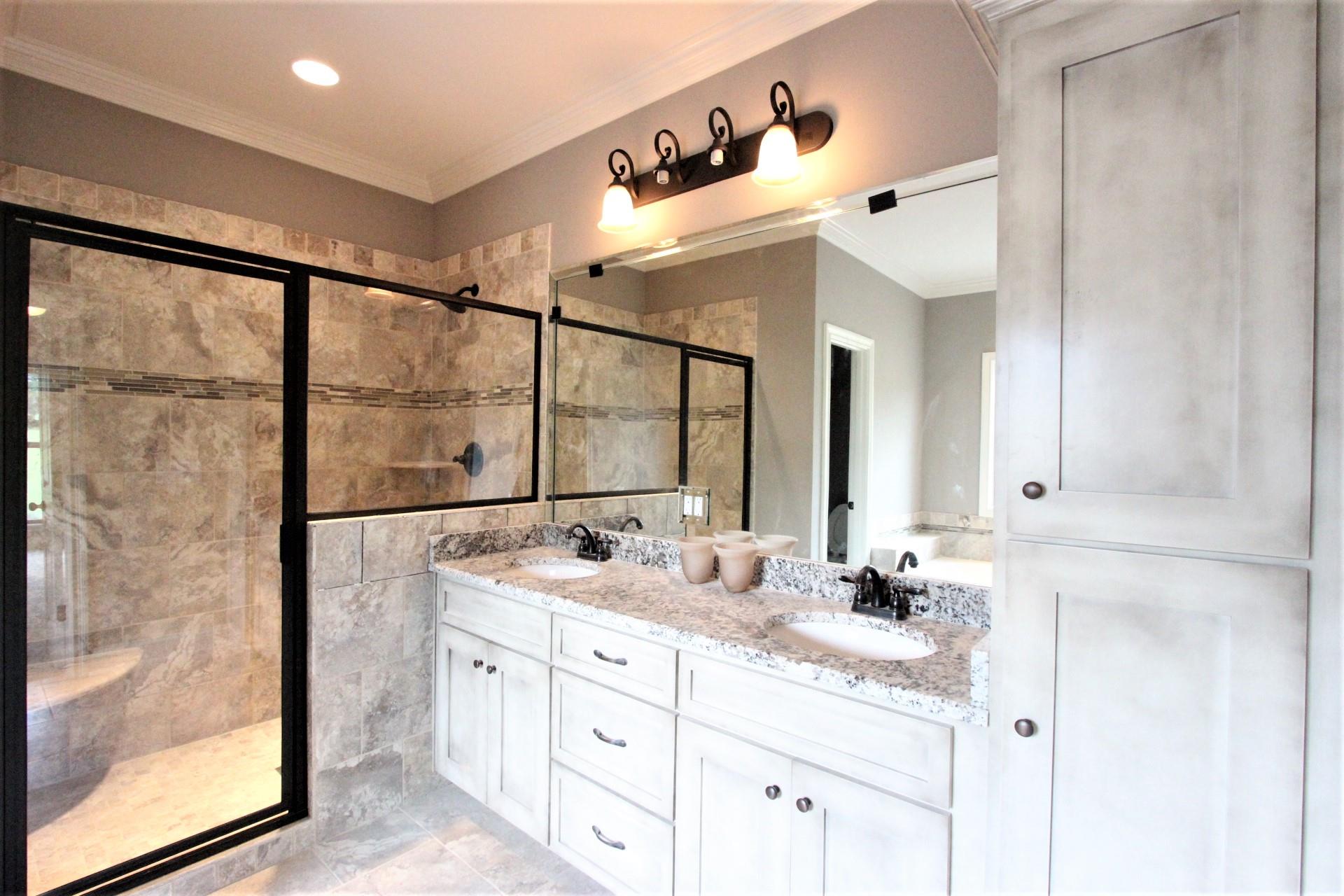 807 Philadelphia Road, Unit 3 Lebanon, TN 37087 - Photo 18 of 23 a bathroom with a double vanity sink and mirror