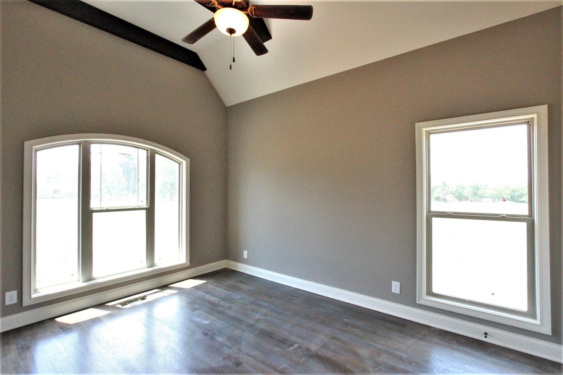 807 Philadelphia Road, Unit 3 Lebanon, TN 37087 - Photo 3 of 23 an empty room with wooden floor and windows