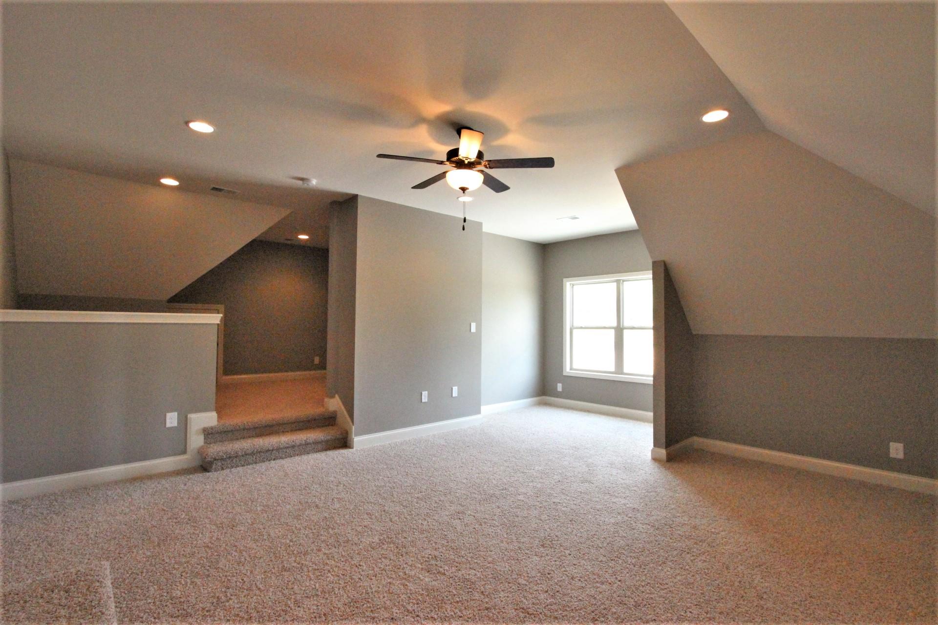 807 Philadelphia Road, Unit 3 Lebanon, TN 37087 - Photo 22 of 23 a view of a livingroom with a ceiling fan and window