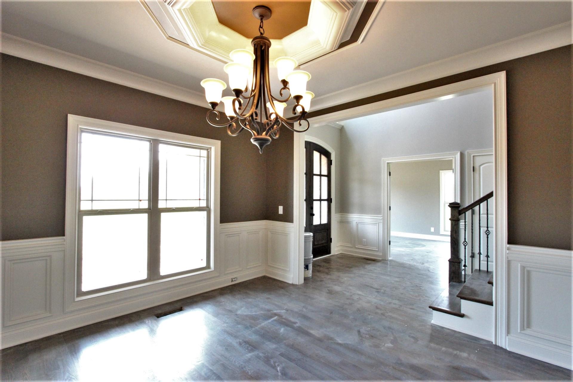 807 Philadelphia Road, Unit 3 Lebanon, TN 37087 - Photo 6 of 23 a view of a livingroom with a chandelier fan and windows