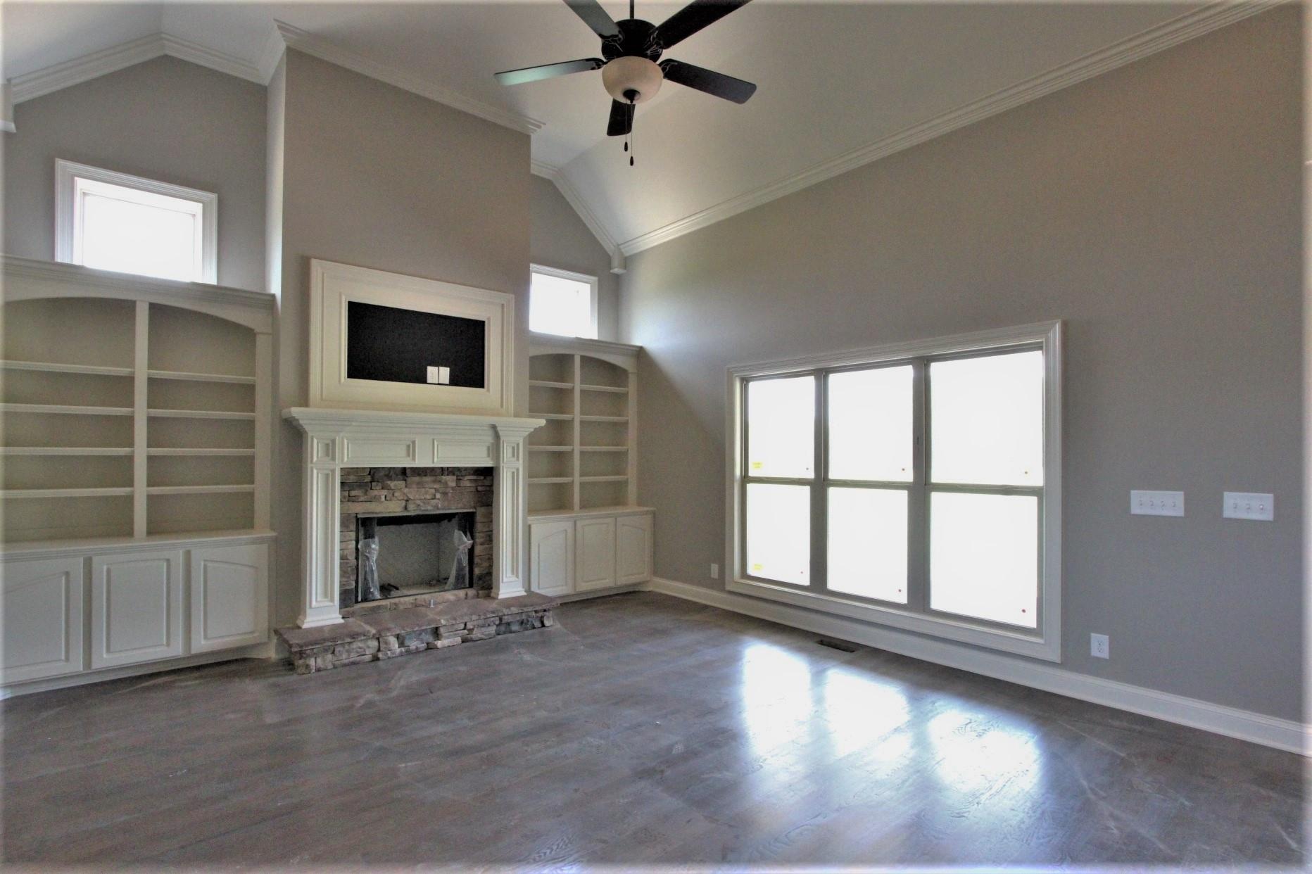 807 Philadelphia Road, Unit 3 Lebanon, TN 37087 - Photo 7 of 23 a view of an empty room with a fireplace and a window