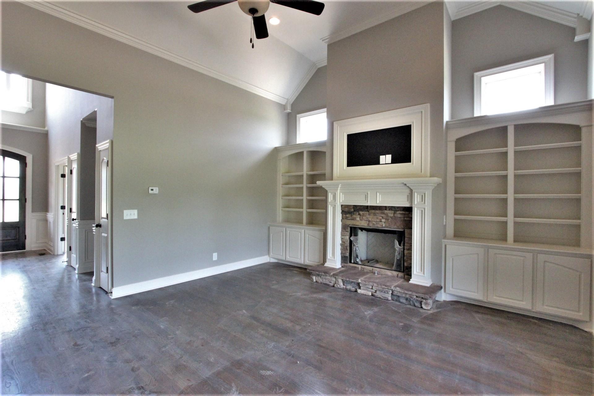 807 Philadelphia Road, Unit 3 Lebanon, TN 37087 - Photo 8 of 23 a living room with a fireplace and a flat screen tv