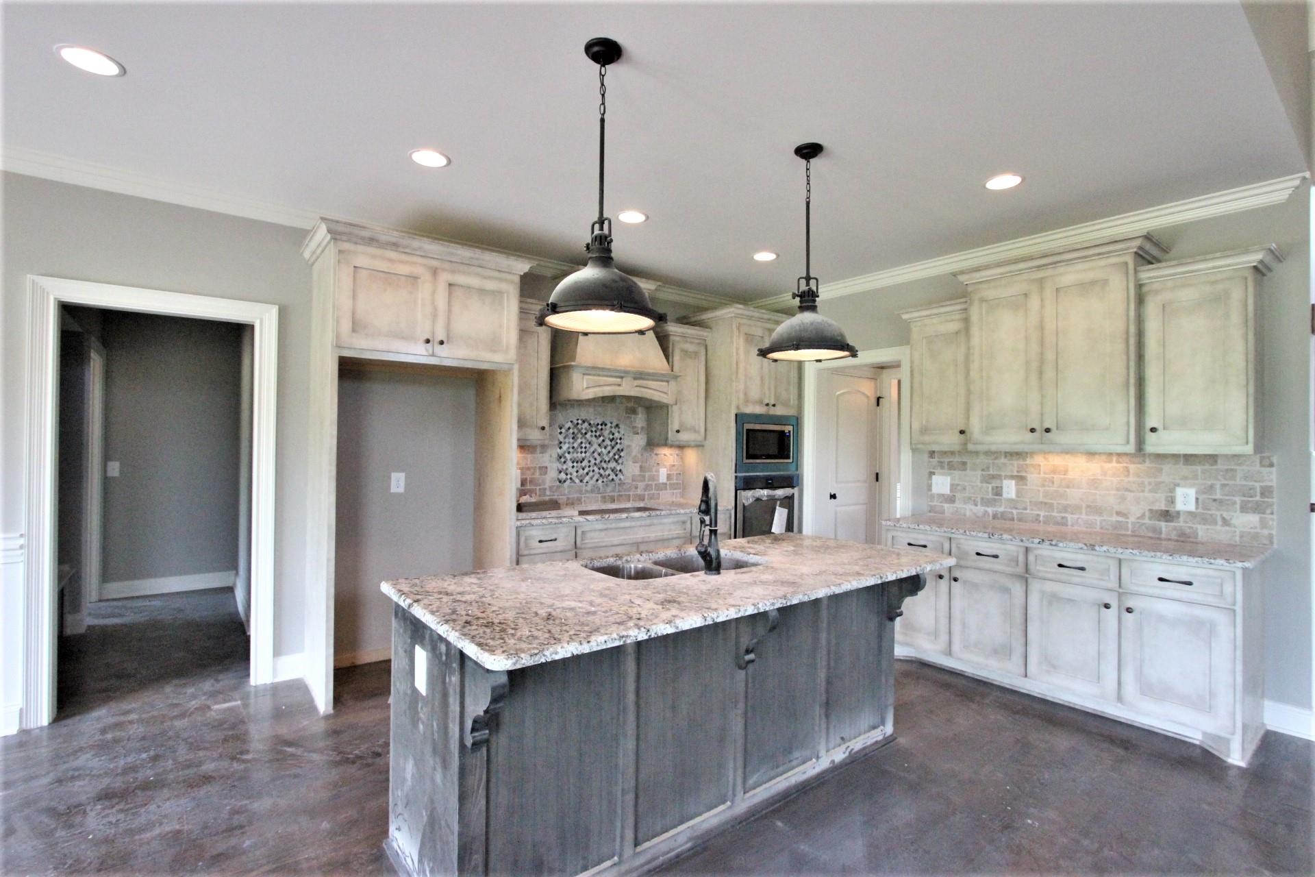 807 Philadelphia Road, Unit 3 Lebanon, TN 37087 - Photo 10 of 23 a large kitchen with kitchen island a sink stainless steel appliances and cabinets