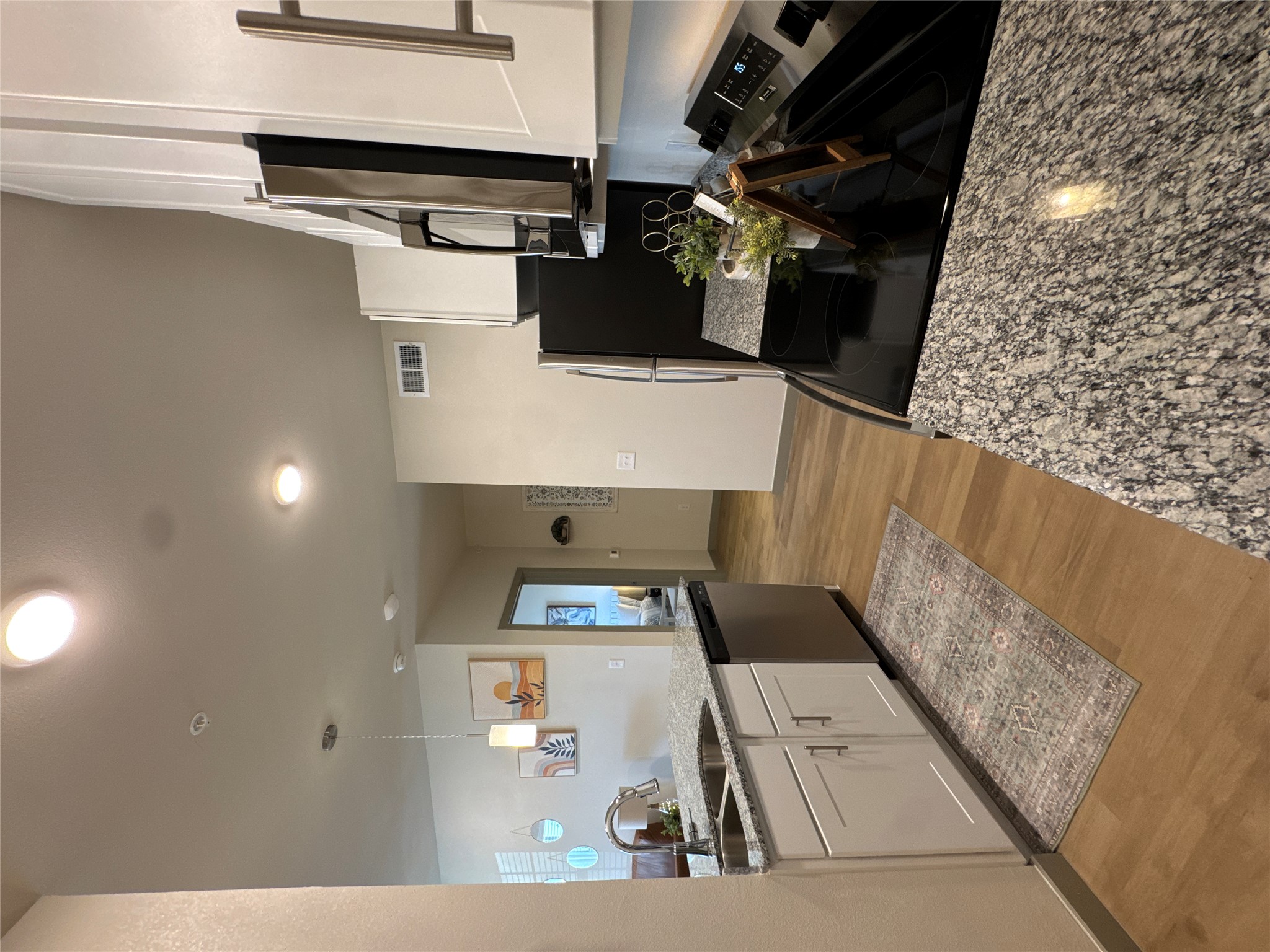 691 Union Chapel Road, Unit A1 Cedar Creek, TX 78612 - Photo 13 of 14 a kitchen with a sink appliances and cabinets