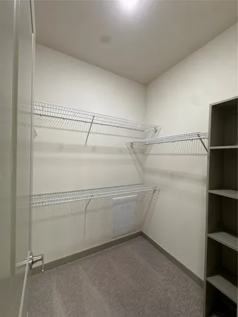 a view of an empty walk in closet