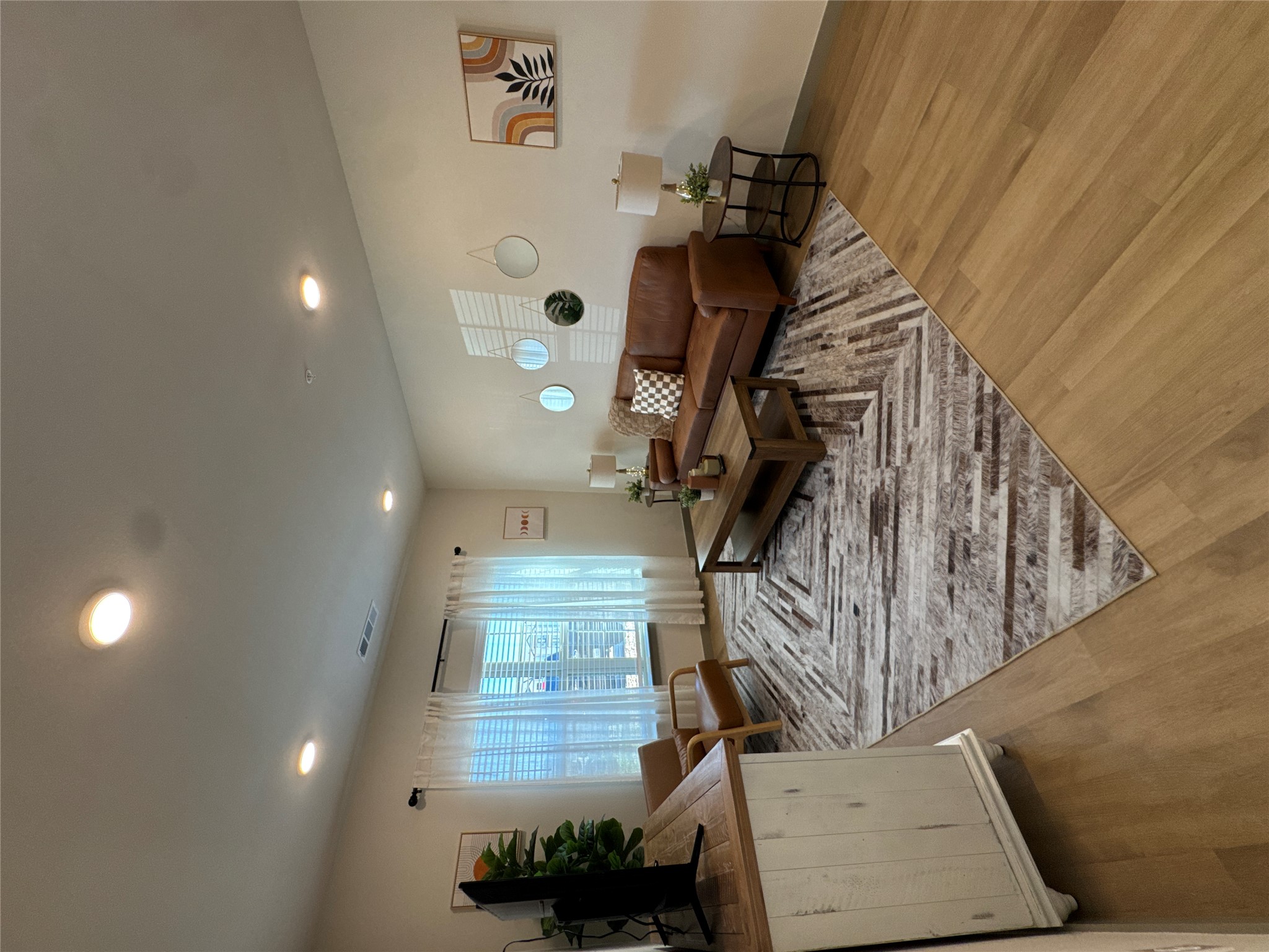 691 Union Chapel Road, Unit A1 Cedar Creek, TX 78612 - Photo 2 of 14 a living room with furniture and a wooden floor