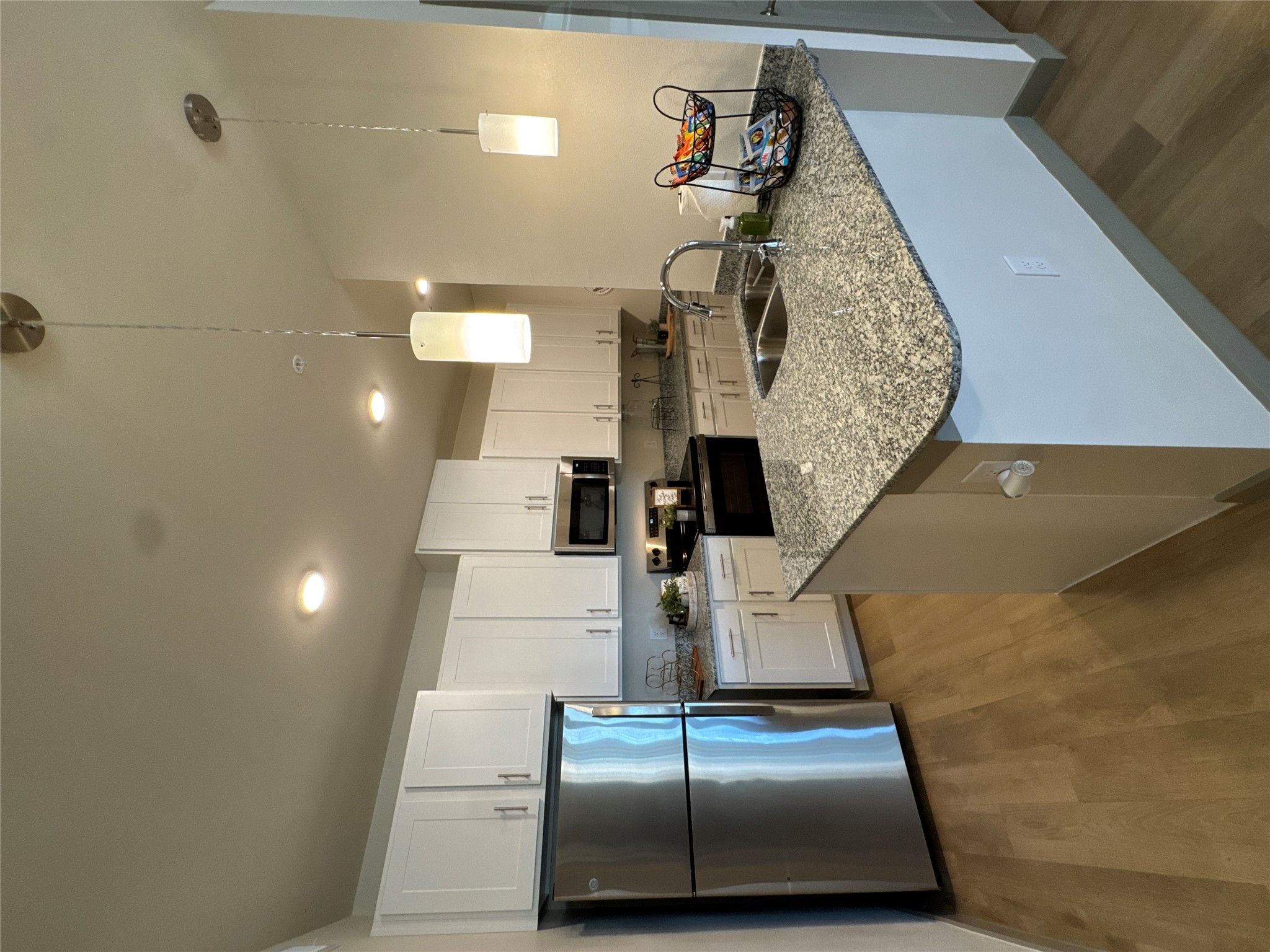 691 Union Chapel Road, Unit A1 Cedar Creek, TX 78612 - Photo 3 of 14 a kitchen with stainless steel appliances granite countertop a sink stove and refrigerator