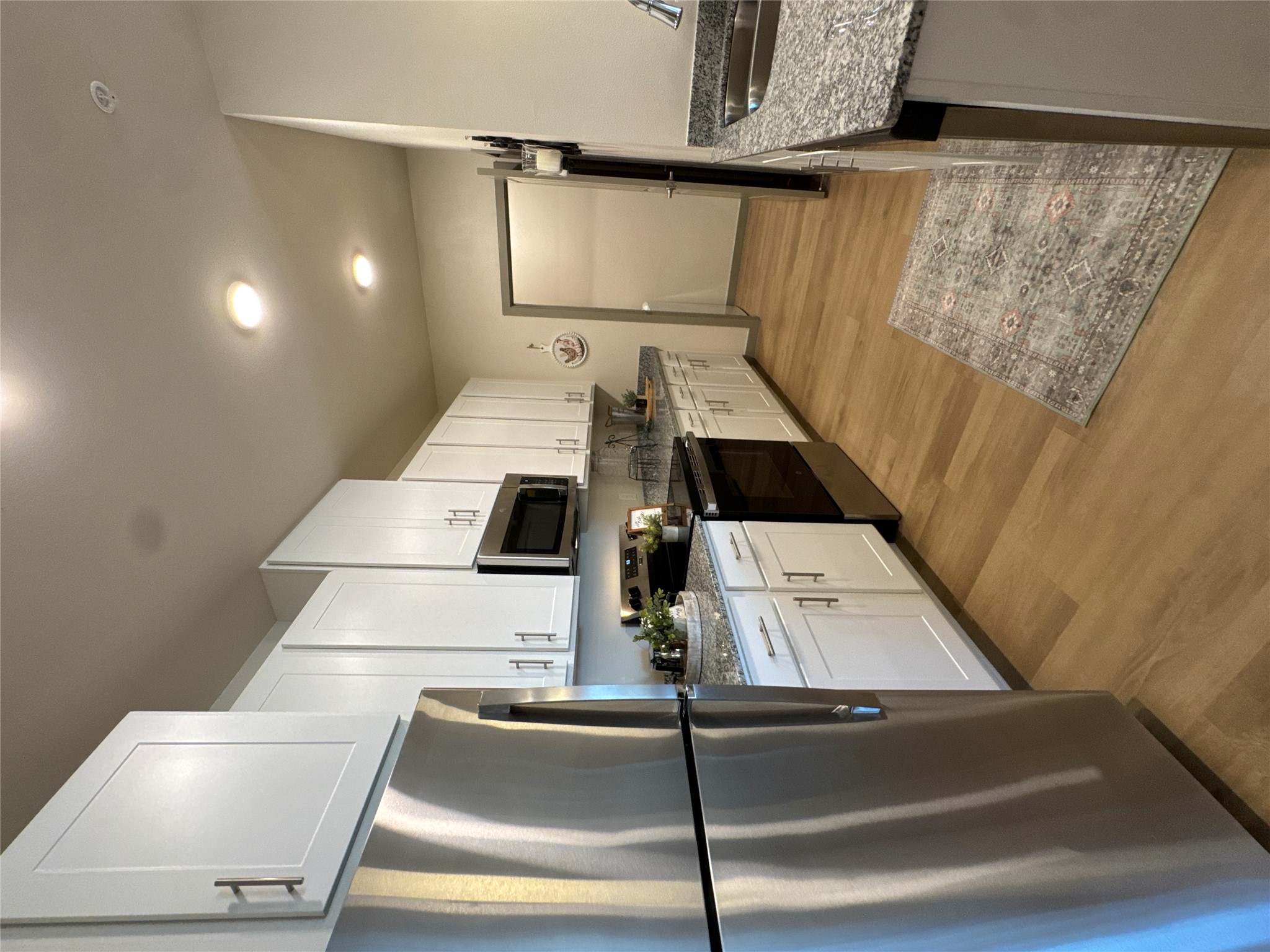691 Union Chapel Road, Unit A1 Cedar Creek, TX 78612 - Photo 4 of 14 a kitchen with a refrigerator sink and microwave