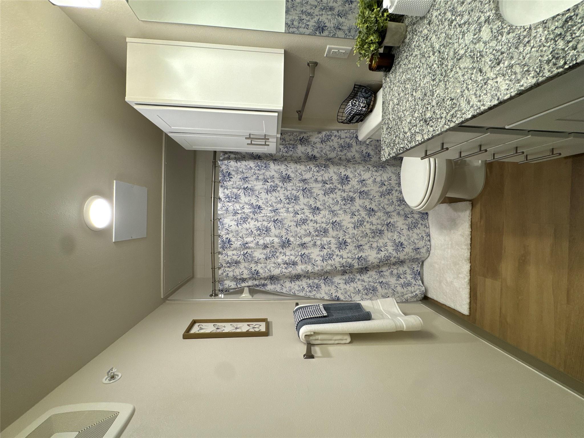 691 Union Chapel Road, Unit A1 Cedar Creek, TX 78612 - Photo 8 of 14 a bathroom with a granite countertop sink a toilet a mirror and shower