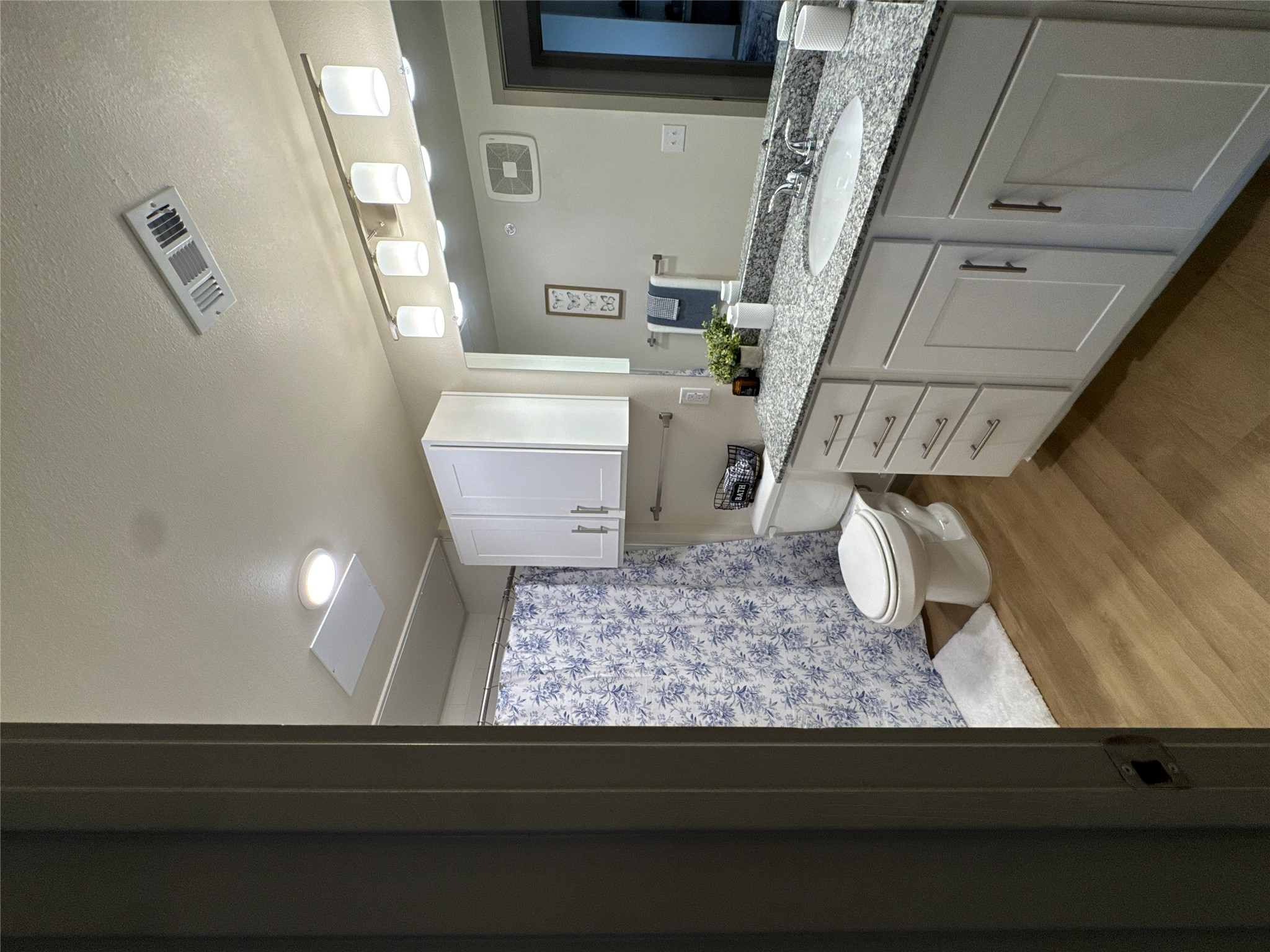 691 Union Chapel Road, Unit A1 Cedar Creek, TX 78612 - Photo 9 of 14 a bathroom with a granite countertop sink toilet and mirror