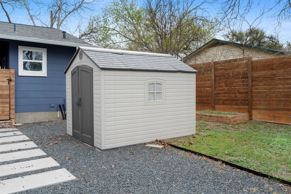3404 Touchstone Street Austin, TX 78723 - Photo 28 of 33 View of shed with a fenced backyard