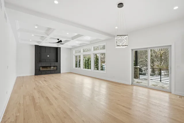 a view of a backyard with wooden fence