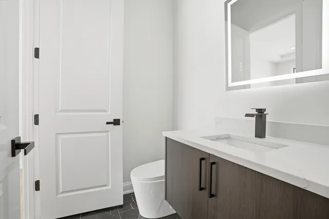 a view of a room with wooden floor and window