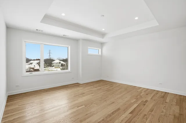 a view of wooden floor in an empty room