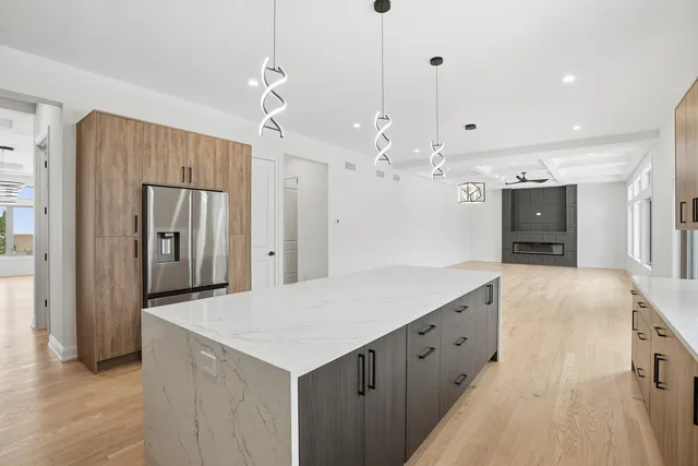a kitchen with a sink stove and cabinets