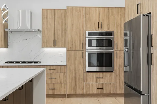 a bathroom with a granite countertop sink and a window