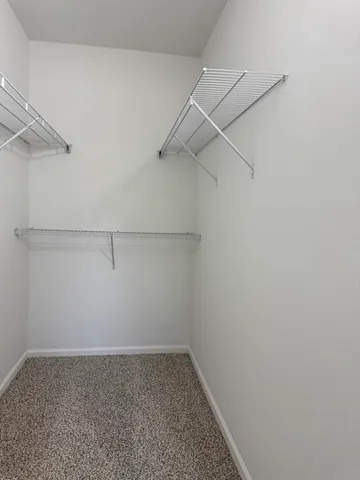 a view of a room with racks on the wall