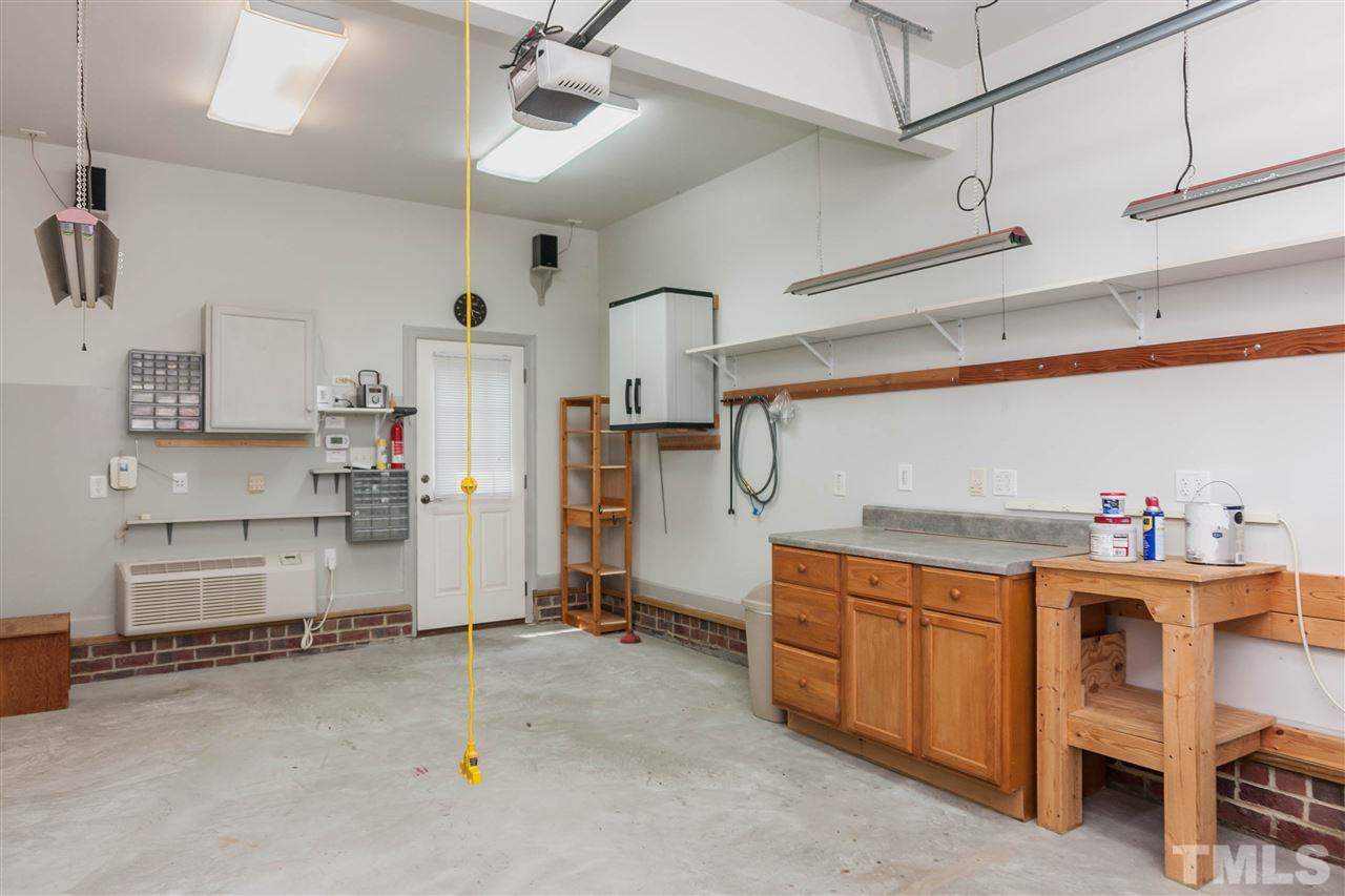 1817 Stannard Trail Raleigh, NC 27612 - Photo 19 of 25 Workshop in 3rd bay of garage. Heated and cooled.