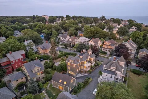 an aerial view of residential houses with outdoor space