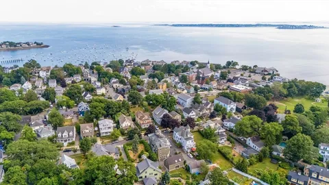 an aerial view of multiple house with outdoor space