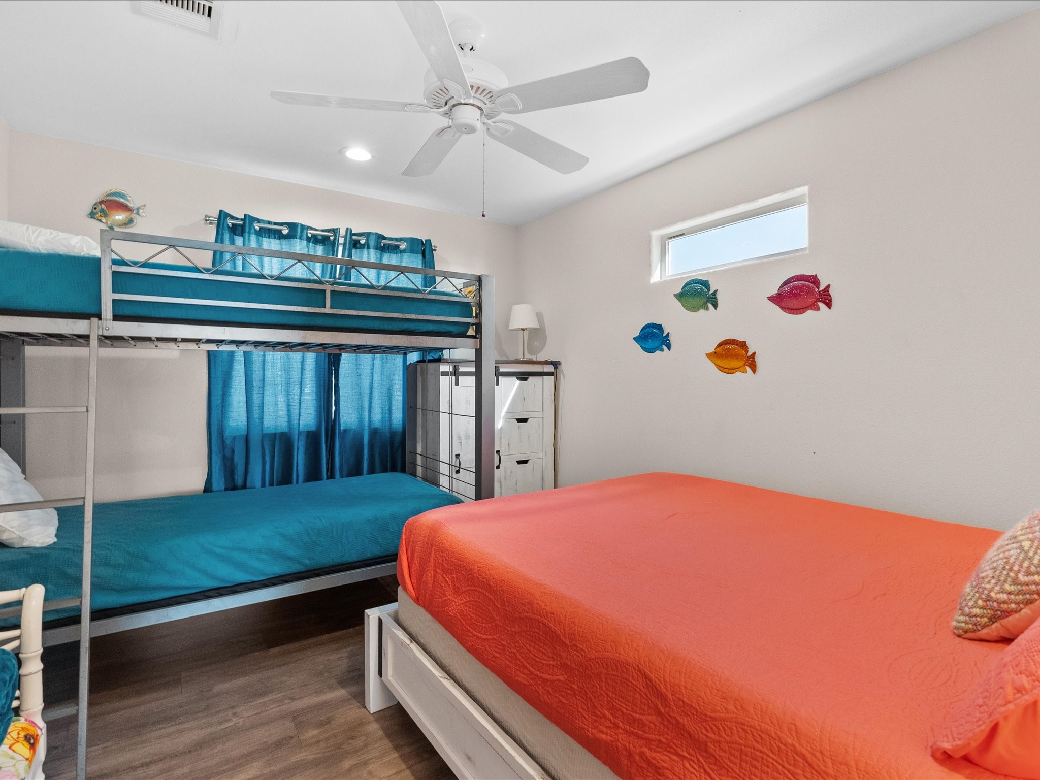 111 Beach Drive Surfside Beach, TX 77541 - Photo 12 of 31 a bedroom with a bed and a window