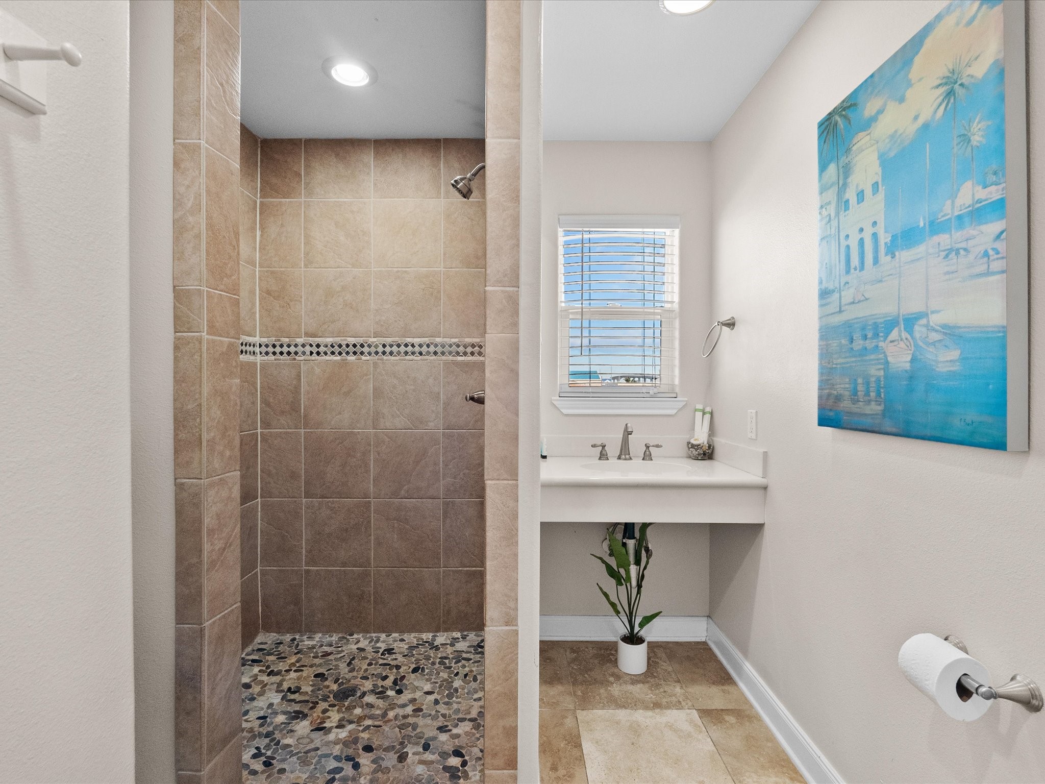 111 Beach Drive Surfside Beach, TX 77541 - Photo 13 of 31 a bathroom with a sink and a shower