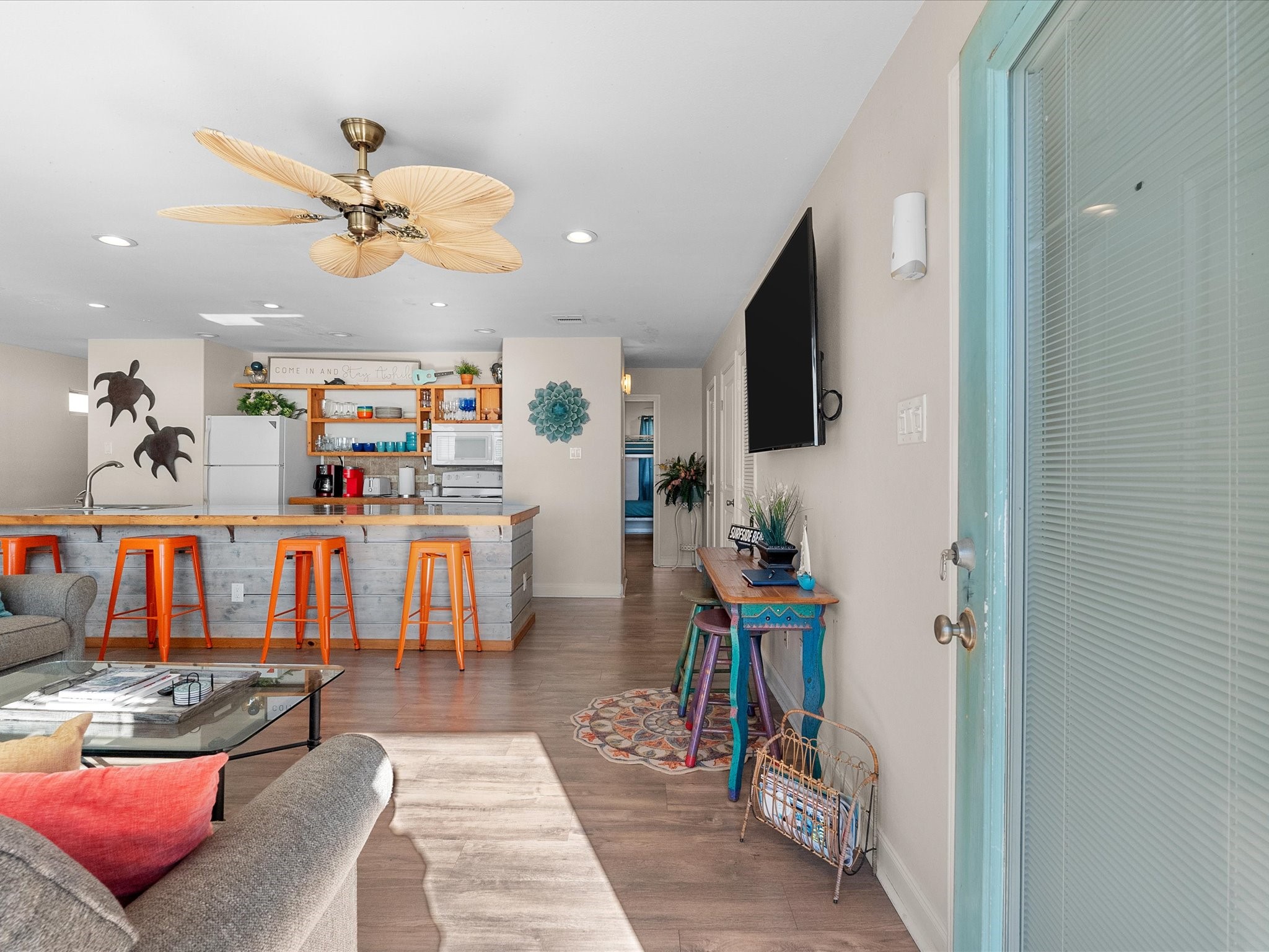 111 Beach Drive Surfside Beach, TX 77541 - Photo 16 of 31 a living room with furniture and a flat screen tv
