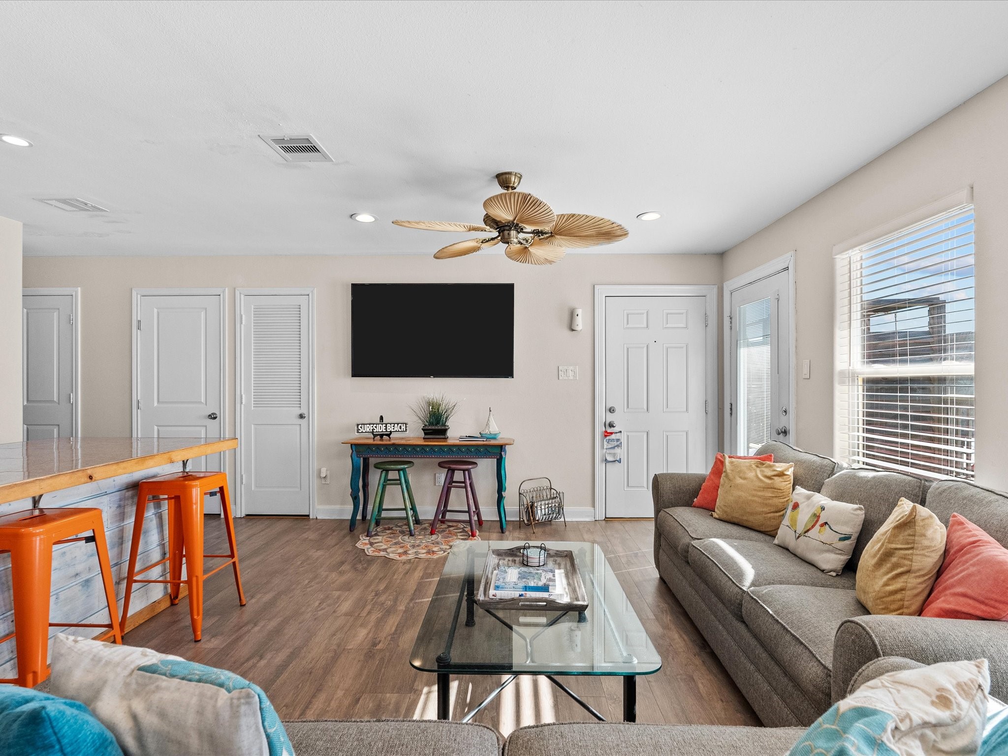 111 Beach Drive Surfside Beach, TX 77541 - Photo 18 of 31 a living room with furniture flat screen tv and wooden floor