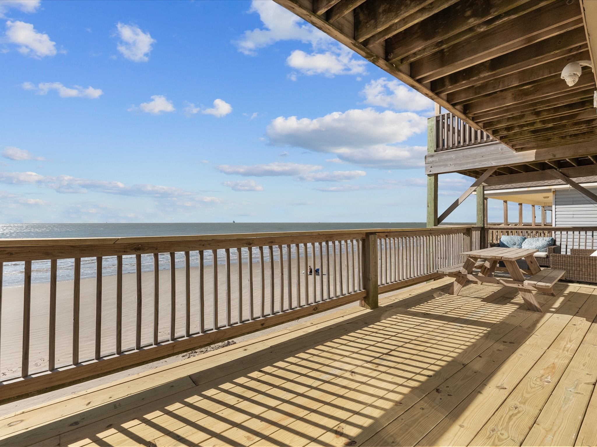 111 Beach Drive Surfside Beach, TX 77541 - Photo 19 of 31 a view of a balcony with wooden floor