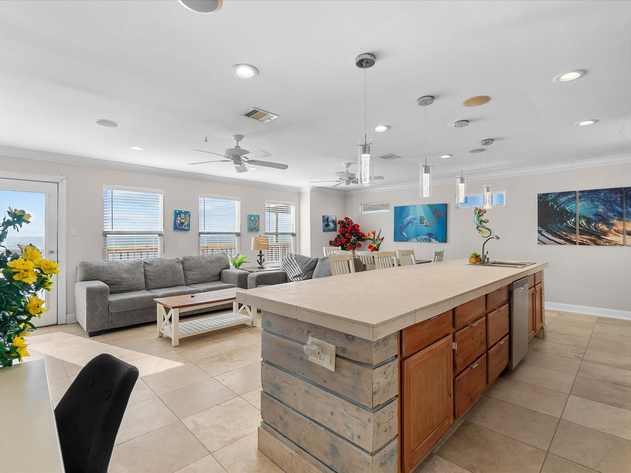 111 Beach Drive Surfside Beach, TX 77541 - Photo 21 of 31 a large living room with stainless steel appliances kitchen island granite countertop furniture and a couch