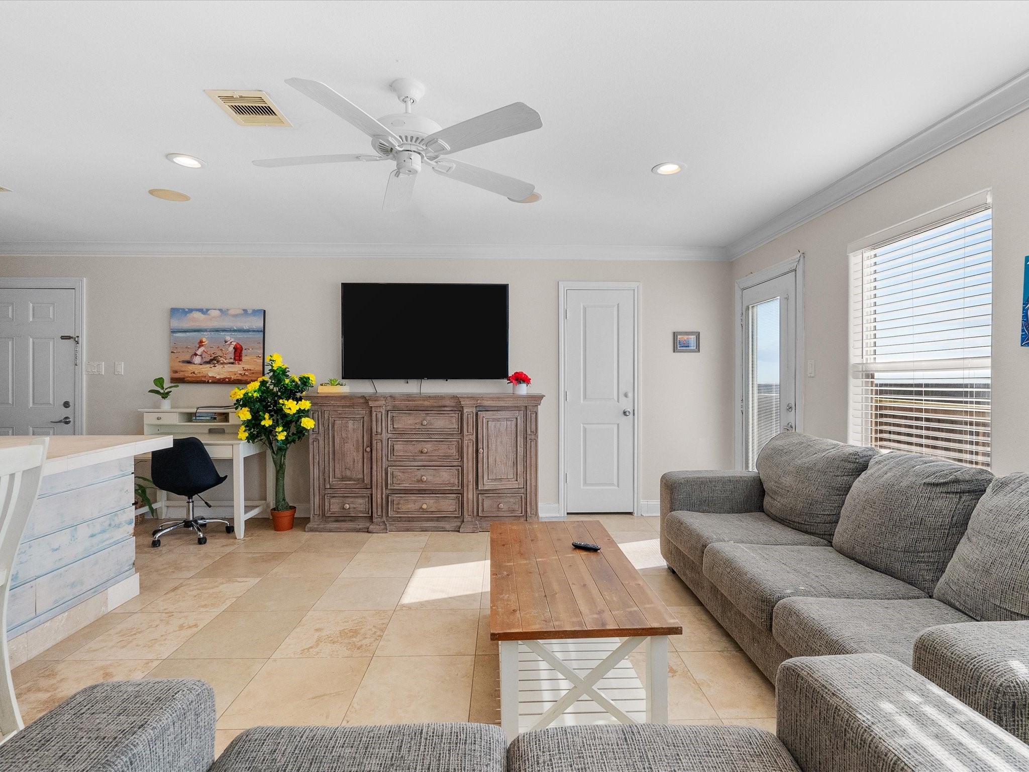 111 Beach Drive Surfside Beach, TX 77541 - Photo 24 of 31 a living room with furniture and a flat screen tv