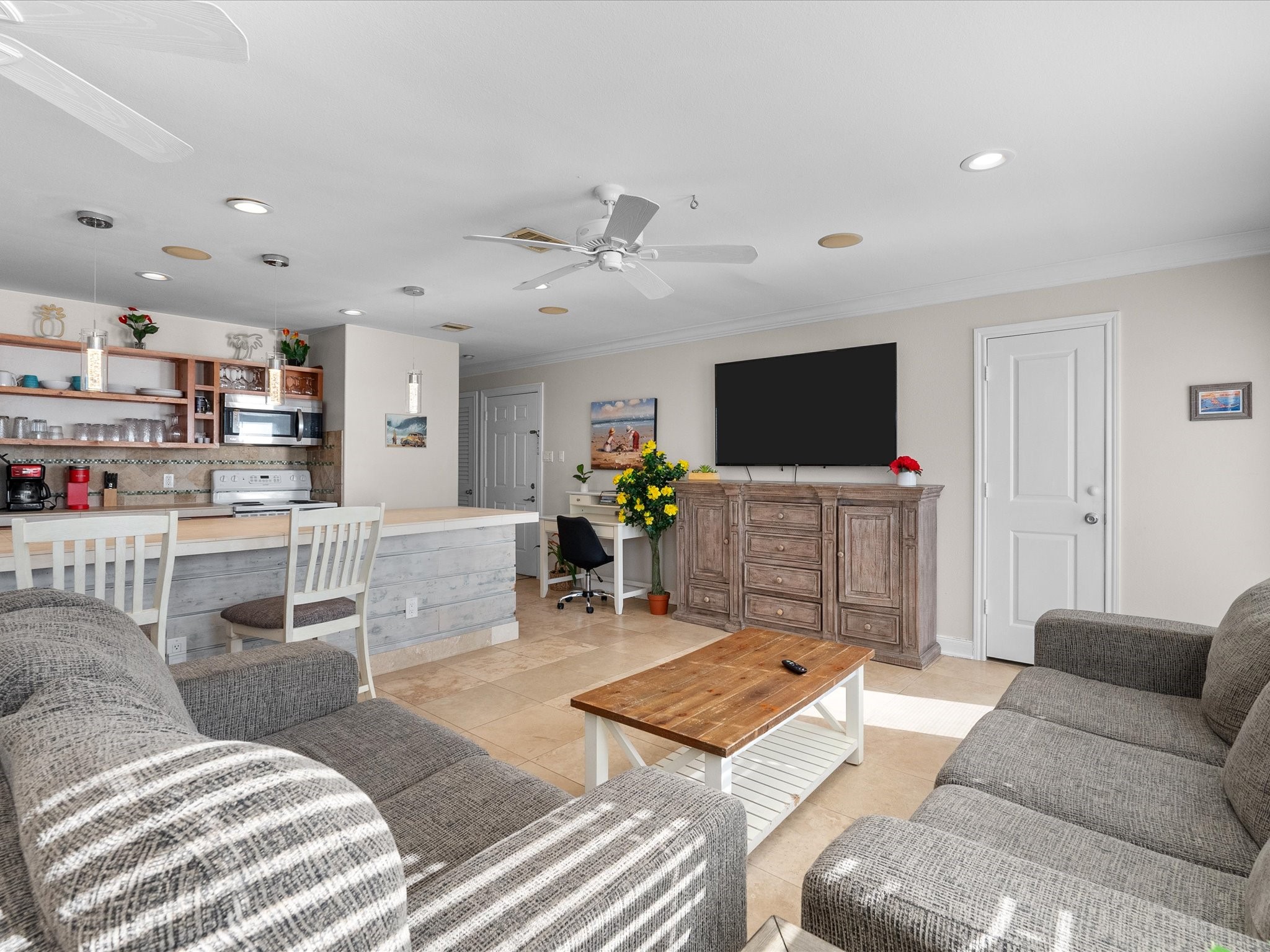 111 Beach Drive Surfside Beach, TX 77541 - Photo 25 of 31 a living room with furniture and a flat screen tv