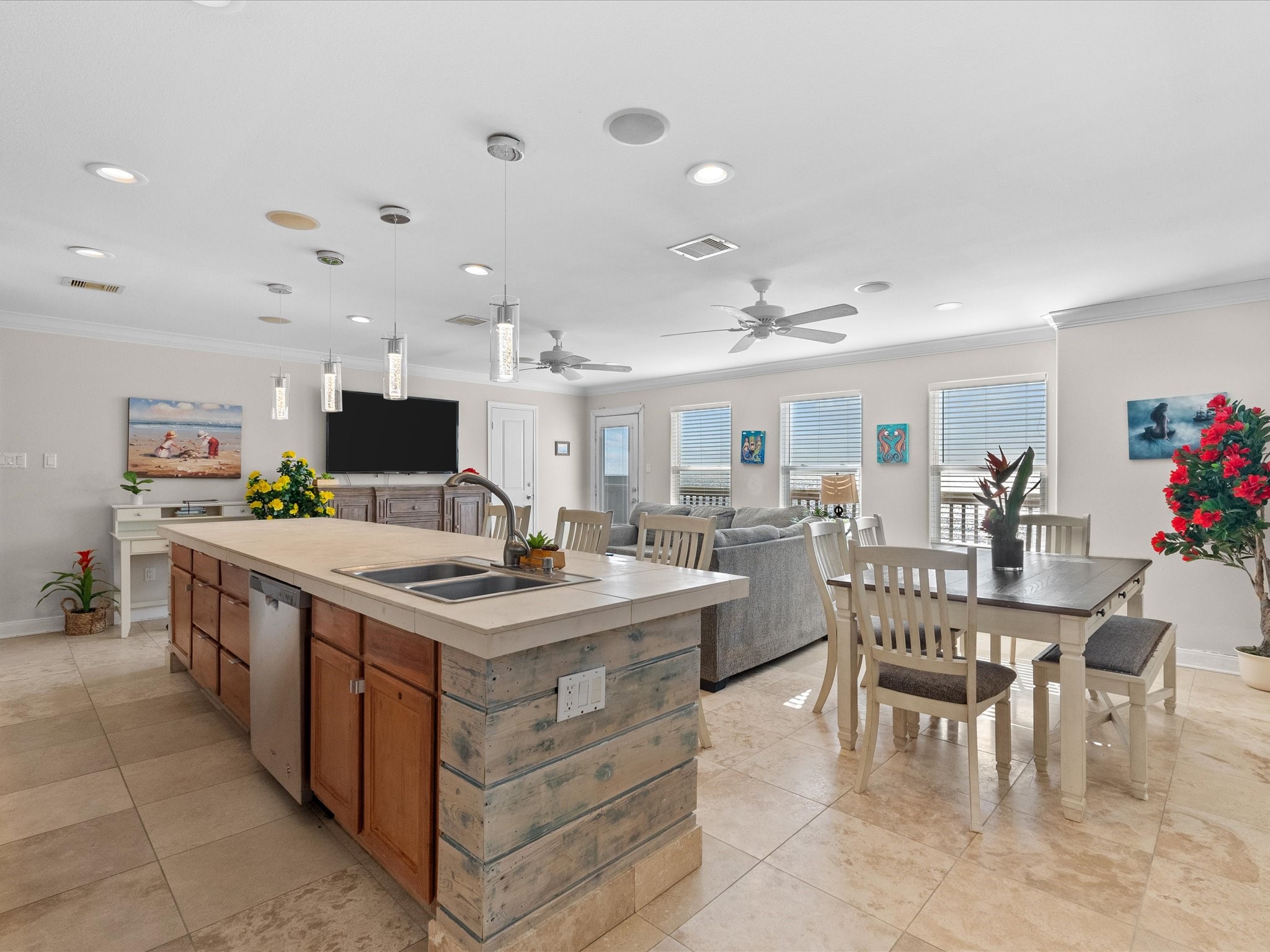 111 Beach Drive Surfside Beach, TX 77541 - Photo 26 of 31 a kitchen with stainless steel appliances granite countertop a table chairs and a refrigerator