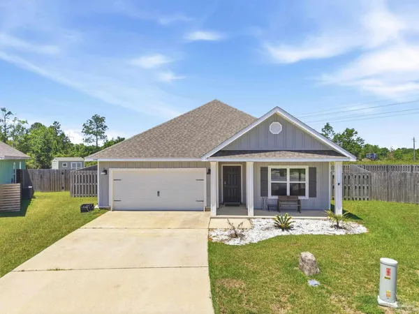 front view of a house with a yard