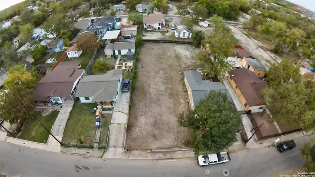 an aerial view of a house with outdoor space and garden view