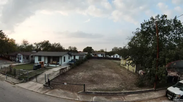 a view of a swimming pool and dinning table and chairs