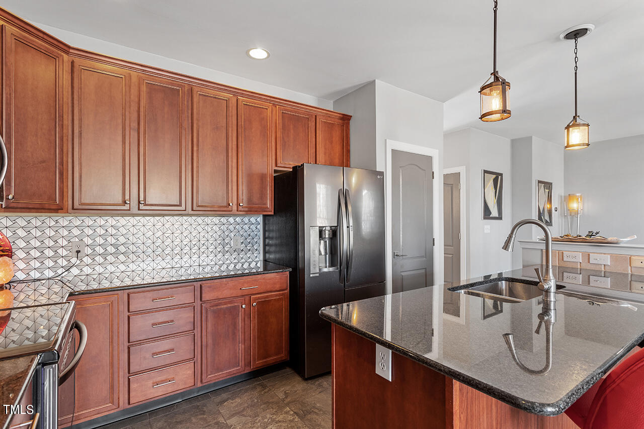 10145 Mizner Lane Raleigh, NC 27617 - Photo 13 of 61 Large island offers plenty of kitchen workspace or a place for entertaining friends