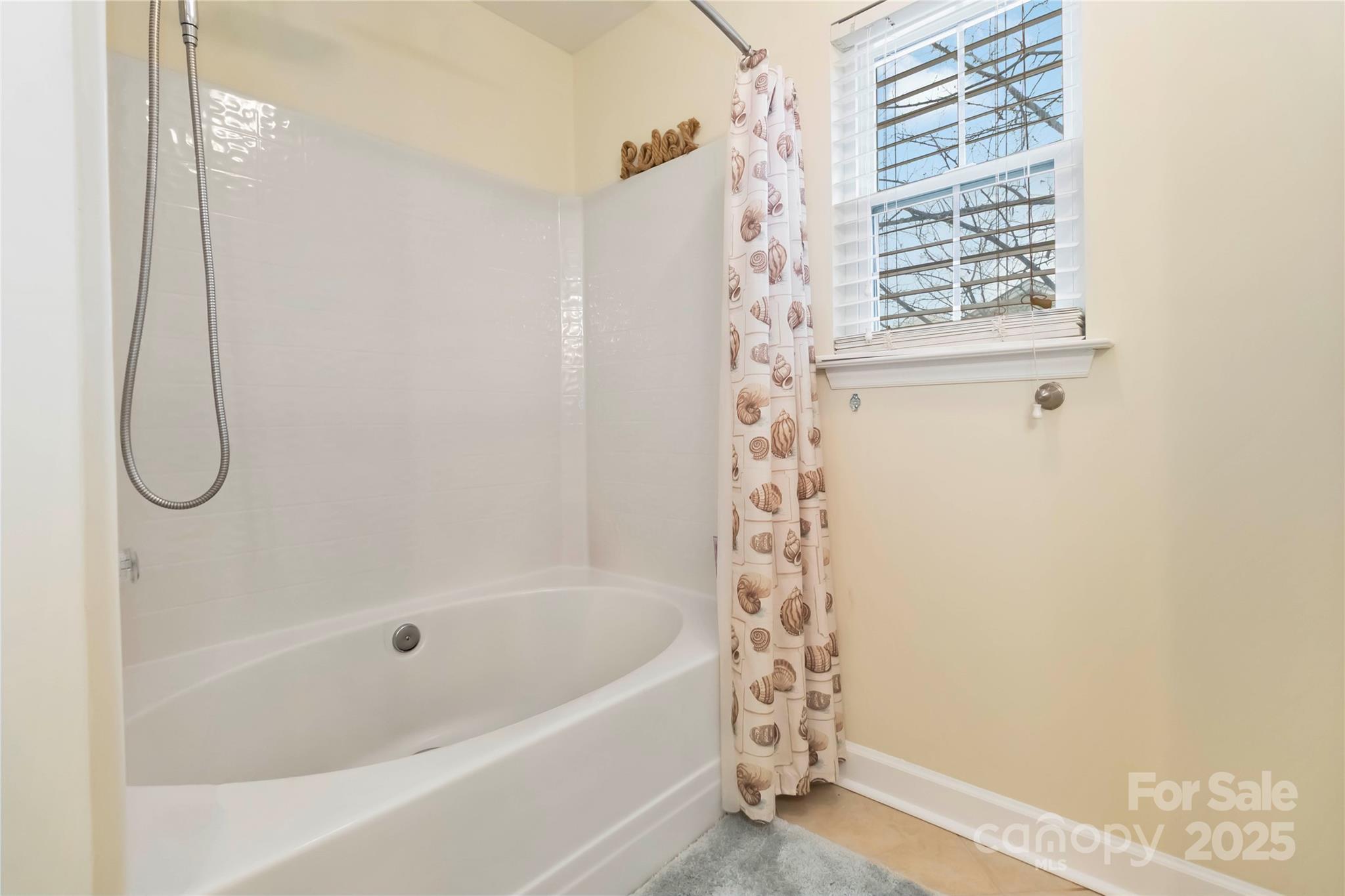 2127 Genesis Drive Monroe, NC 28110 - Photo 15 of 17 a bathroom with a bath tub and shower