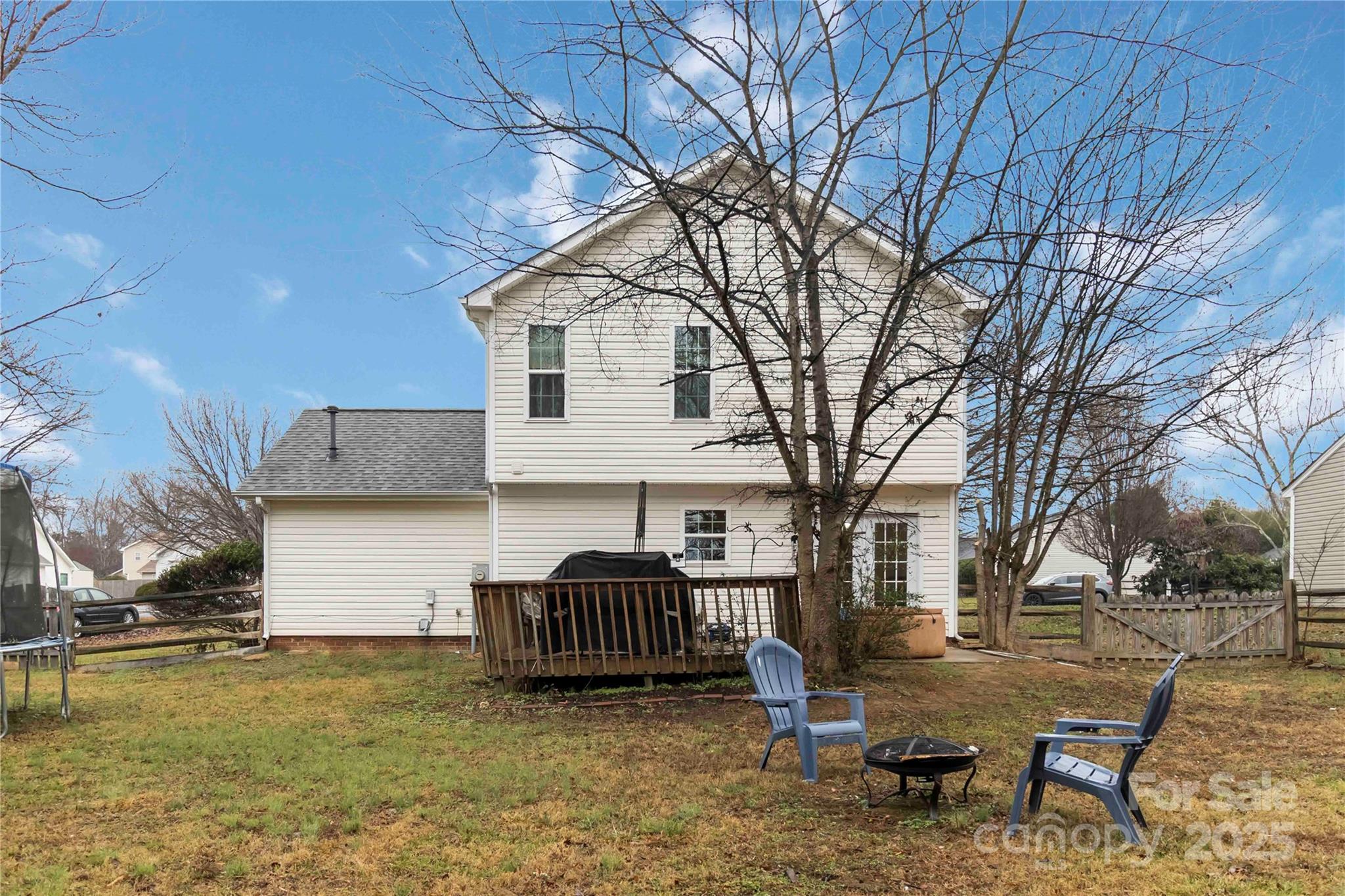 2127 Genesis Drive Monroe, NC 28110 - Photo 16 of 17 a view of a house with backyard and a tree