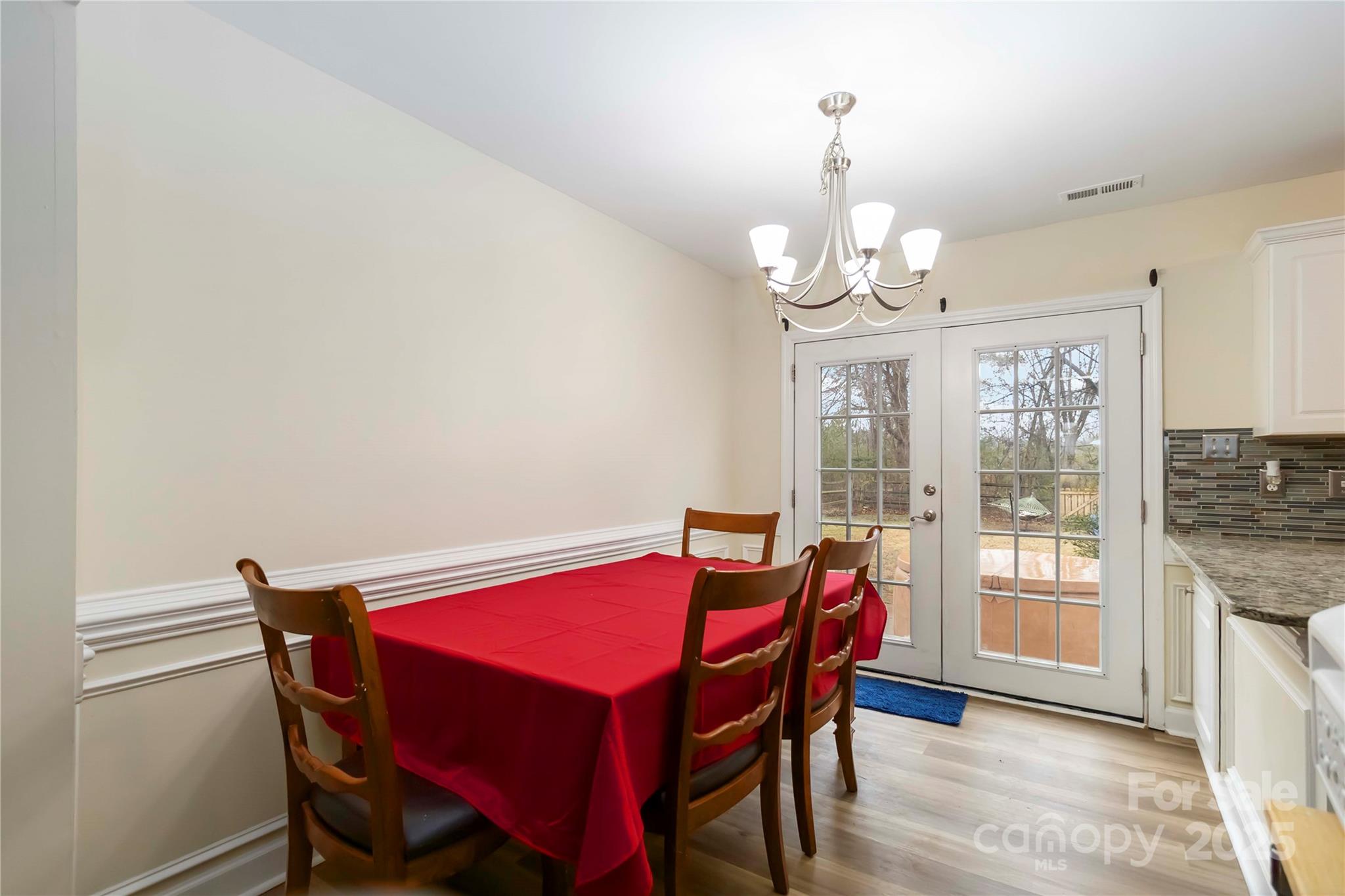 2127 Genesis Drive Monroe, NC 28110 - Photo 7 of 17 a view of a dining room with furniture window and wooden floor
