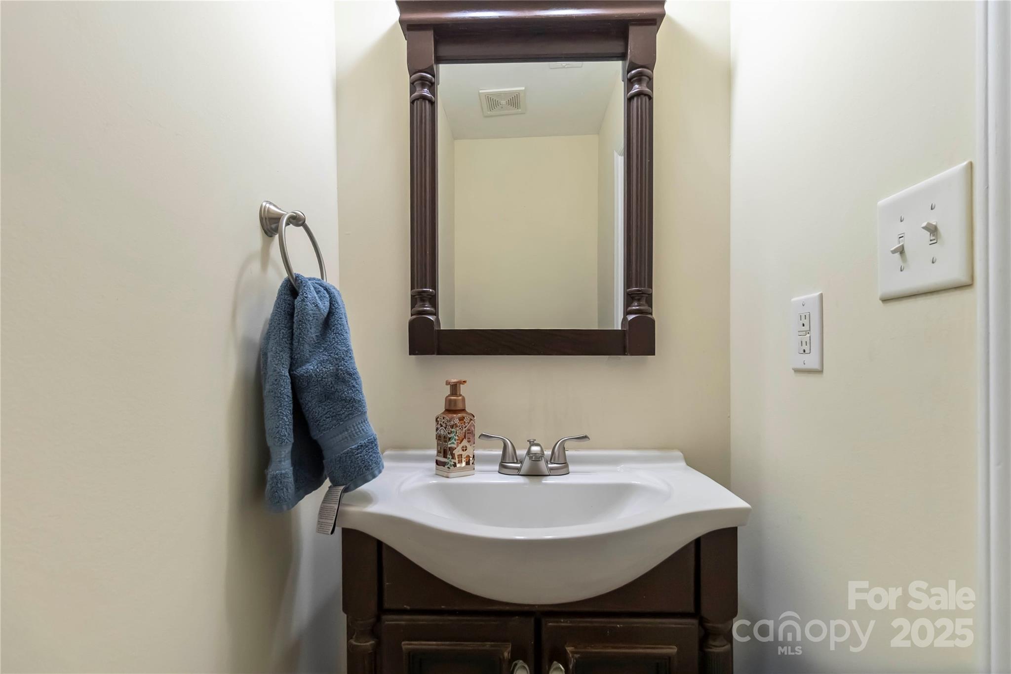 2127 Genesis Drive Monroe, NC 28110 - Photo 9 of 17 a bathroom with a sink and a mirror