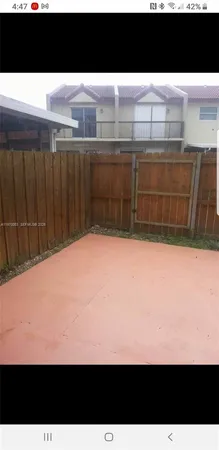 a stove top oven sitting inside of a kitchen