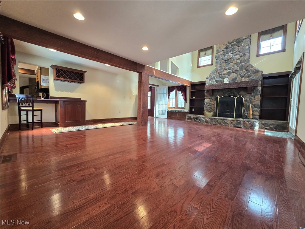 Great room with 2story fireplace,window seating and bar