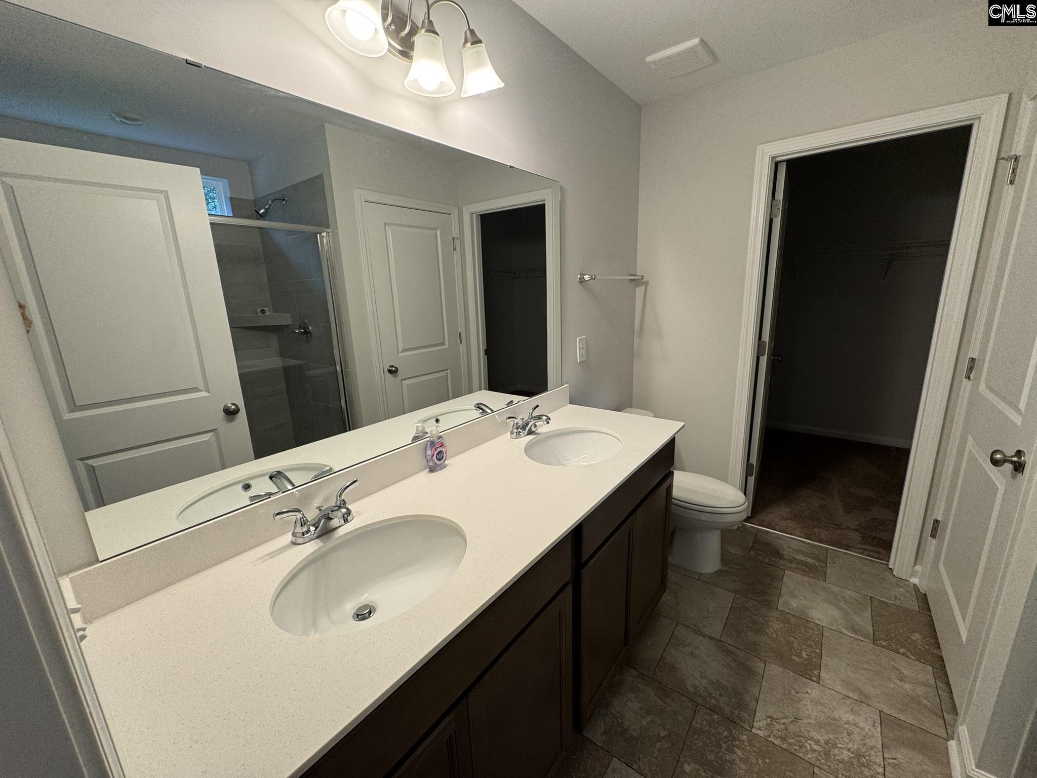 6023 Edgemont Court Elgin, SC 29045 - Photo 13 of 15 a bathroom with a sink and a mirror