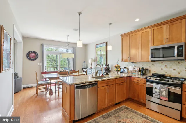 a kitchen with lots of counter top space and dining table