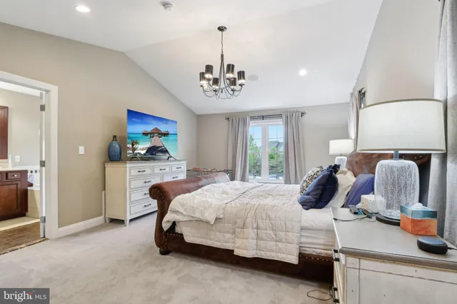 a bedroom with bed and window