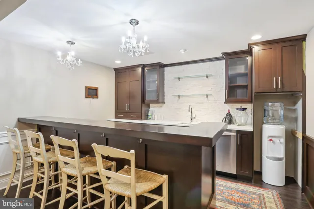 a kitchen with a sink and refrigerator