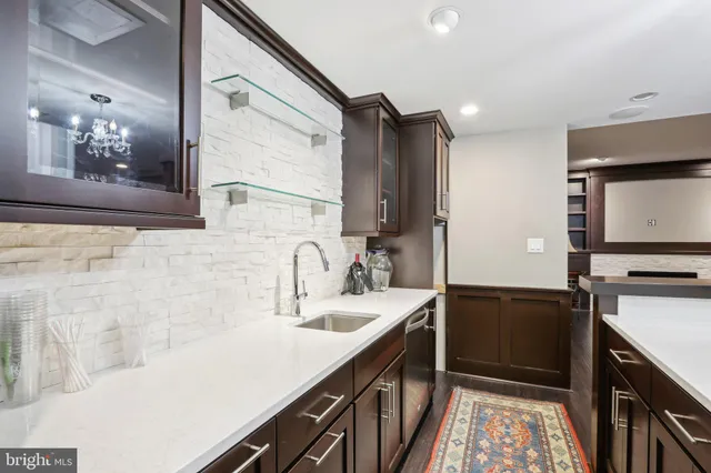a bathroom with a sink a vanity and a mirror