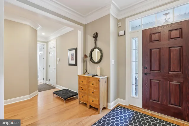 a view of a bedroom with wooden floor and cabinet